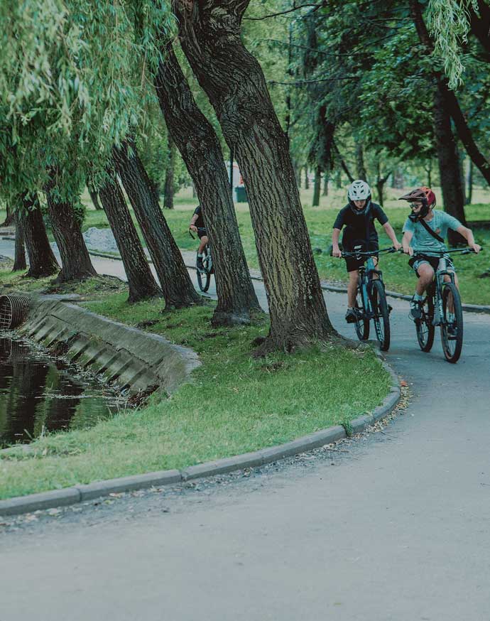People riding bicycles in a park